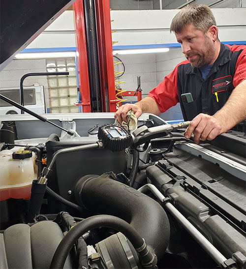 automobile mechanic checking car engine photo