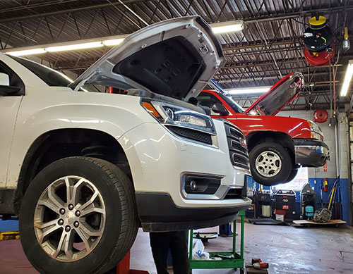 photo of 2 vehicles getting a pre-purchase inspection.